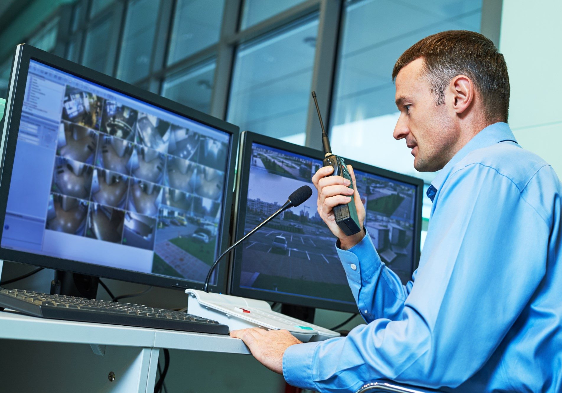 security guard monitoring cameras