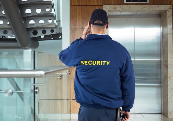 security guard with blue coat